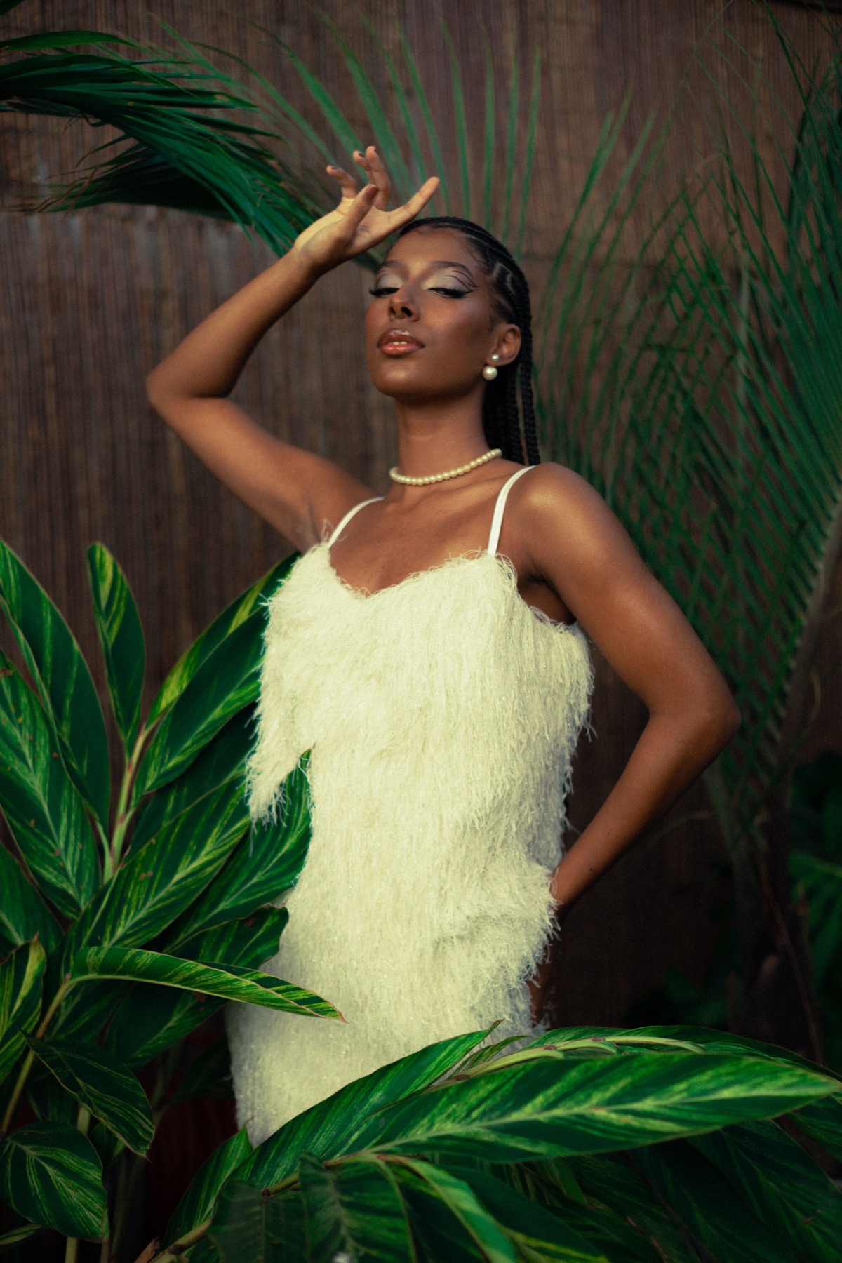 Ijese Wears model wearing a soft yellow outfit